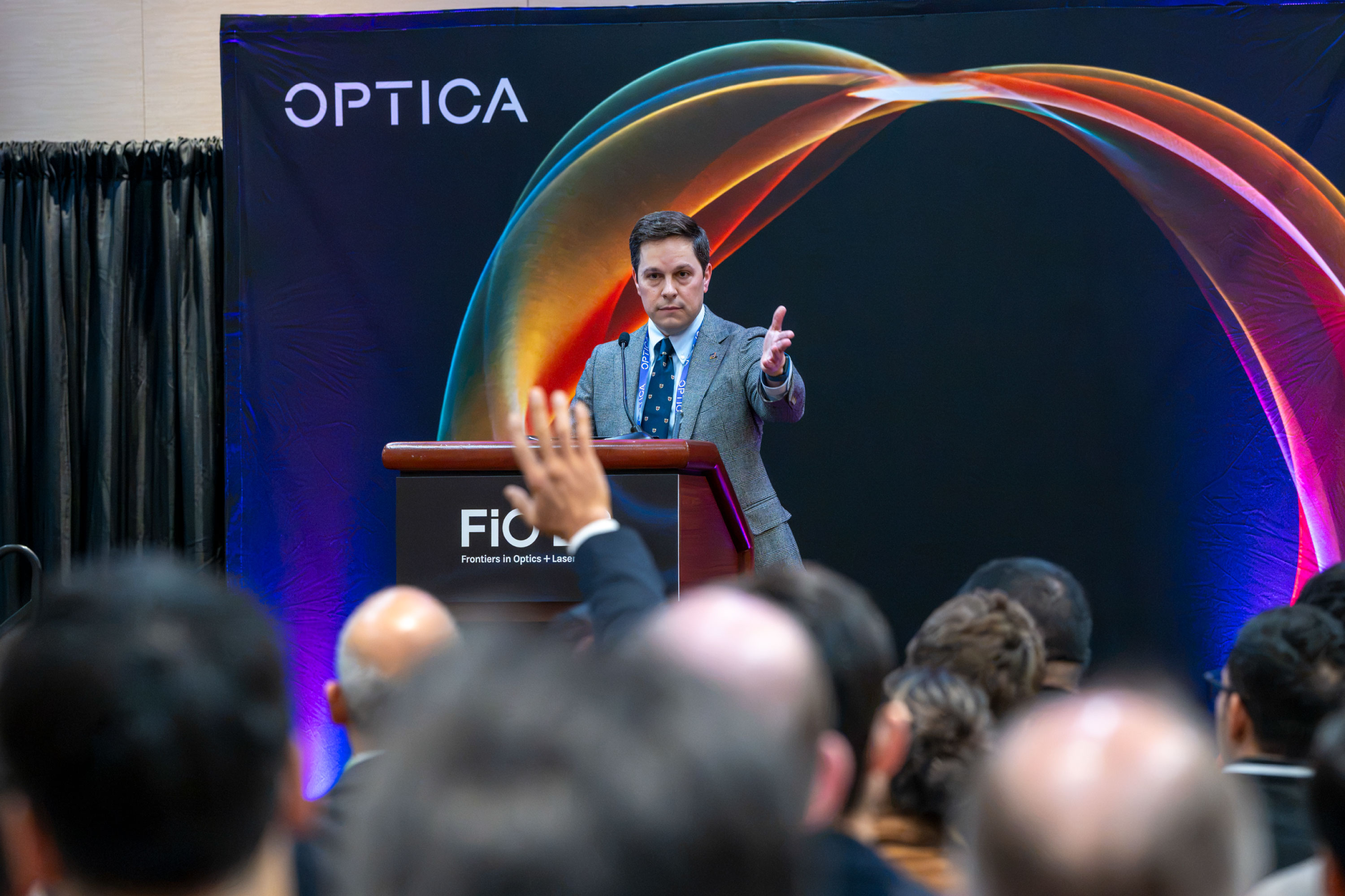 Conference attendees listen attentively to a presentation at FiO.